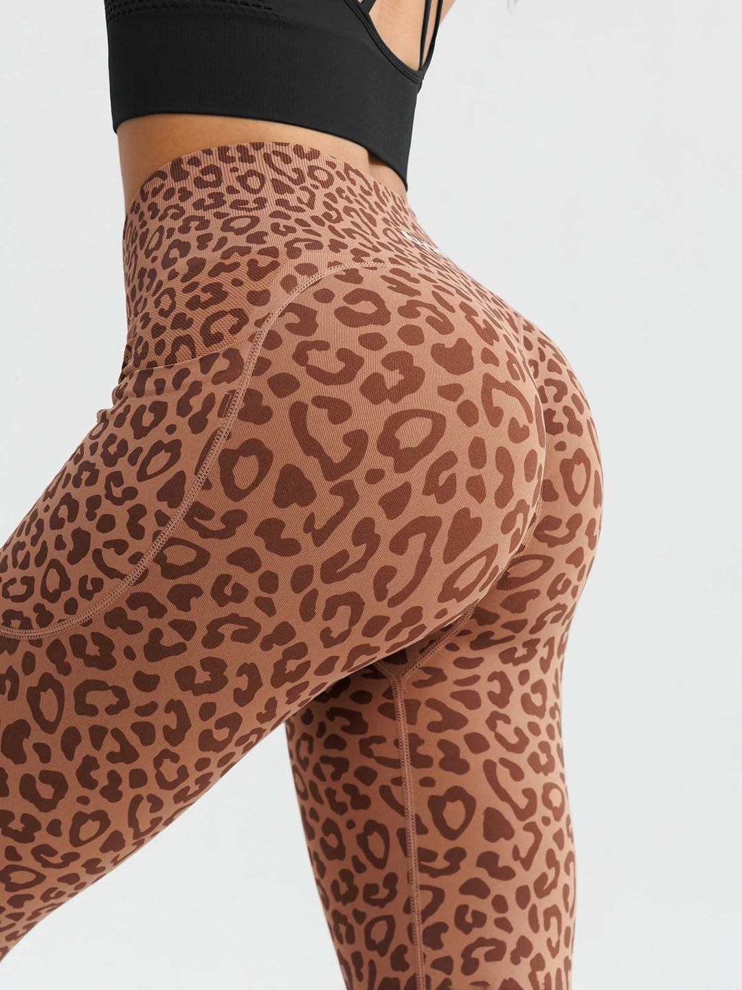A model wearing a BRXL® B R X L™ Seamless High Waisted Butt-Lifting Leggings with Pockets