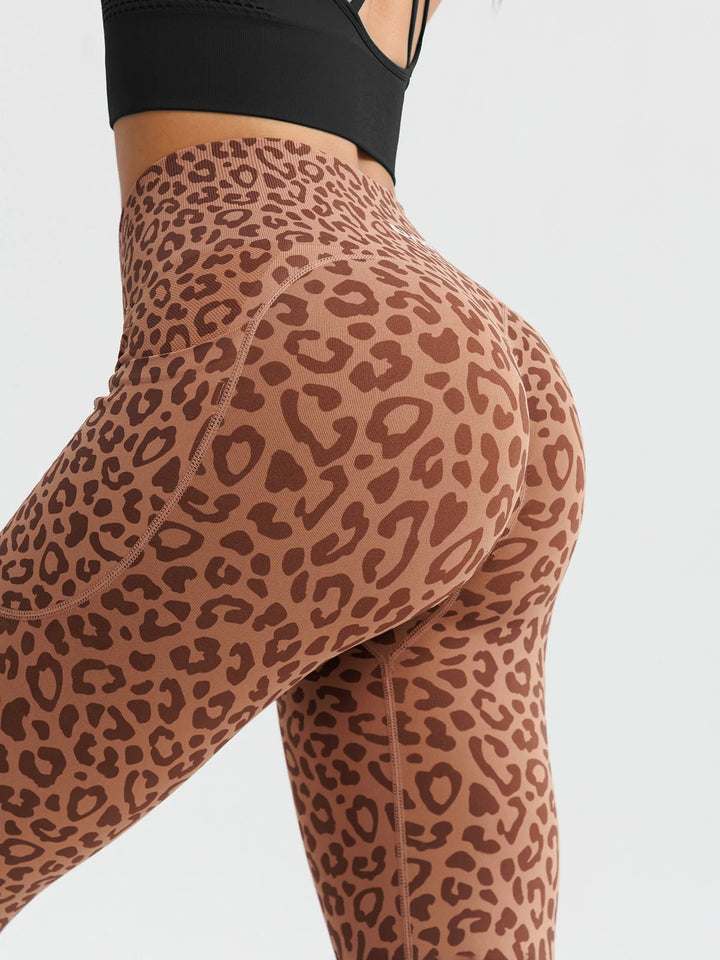A model wearing a BRXL® B R X L™ Seamless High Waisted Butt-Lifting Leggings with Pockets