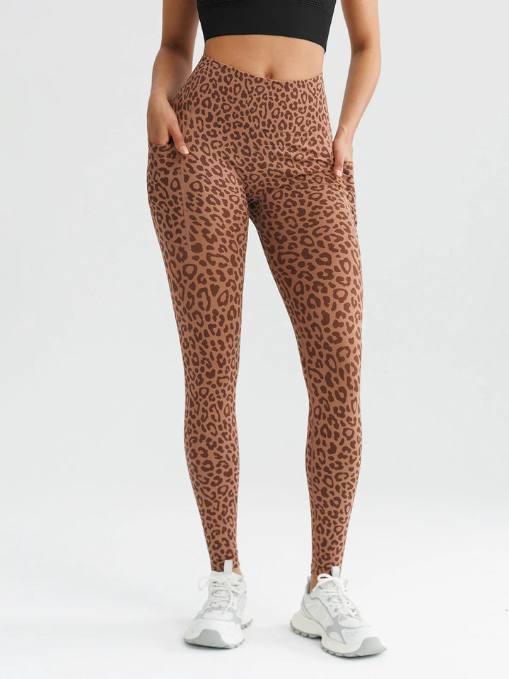 A model wearing a BRXL® B R X L™ Seamless High Waisted Butt-Lifting Leggings with Pockets