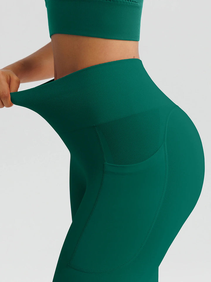 A model wearing a BRXL® B R X L™ Seamless High Waisted Butt-Lifting Leggings with Pockets