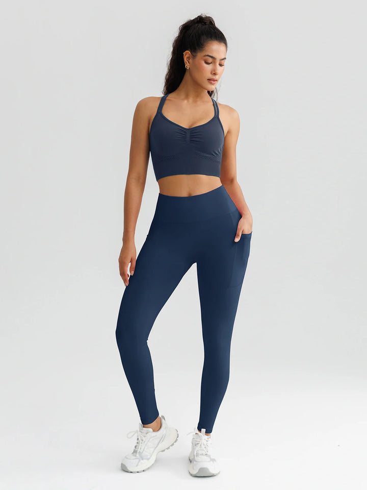 A model wearing a BRXL® B R X L™ Seamless High Waisted Butt-Lifting Leggings with Pockets