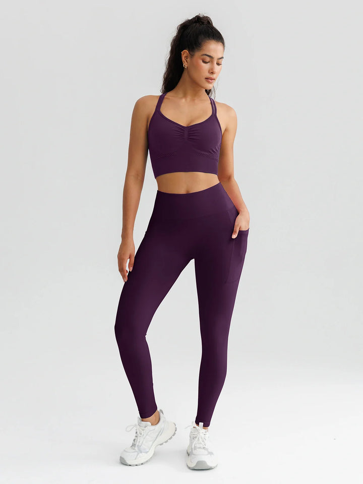A model wearing a BRXL® B R X L™ Seamless High Waisted Butt-Lifting Leggings with Pockets
