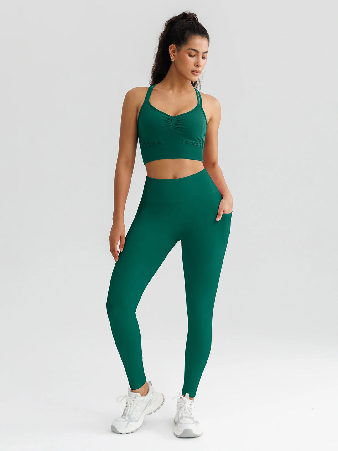 A model wearing a BRXL® B R X L™ Seamless High Waisted Butt-Lifting Leggings with Pockets