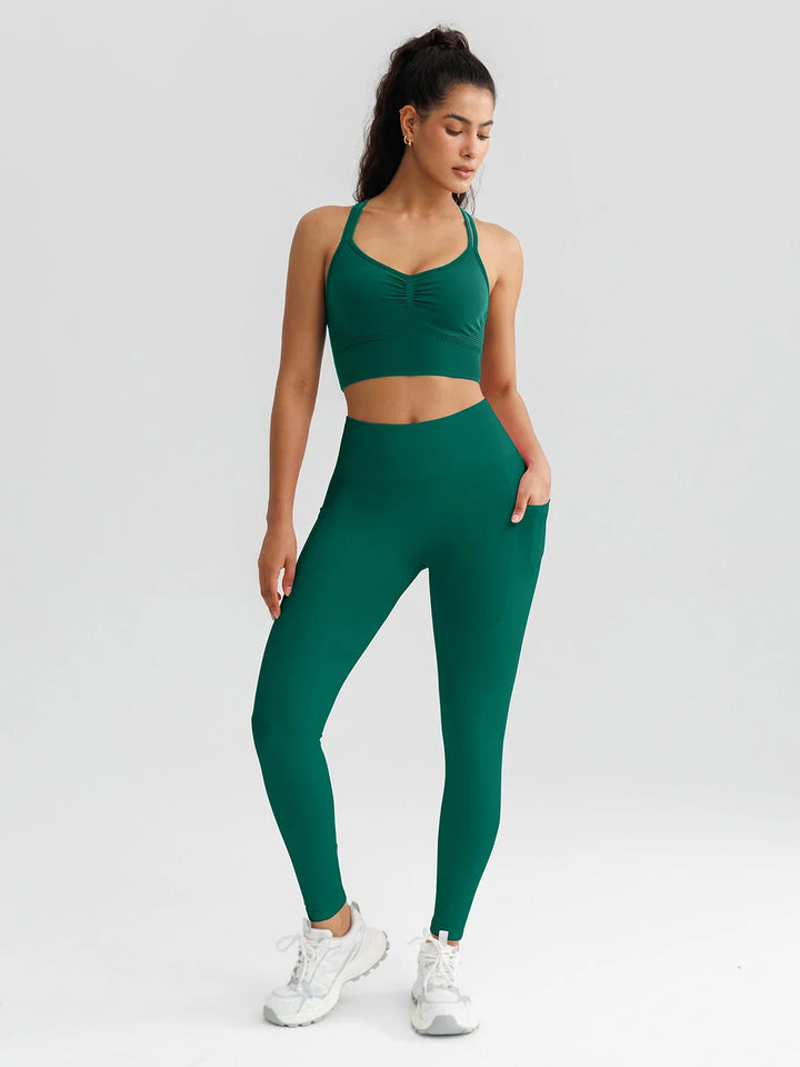 A model wearing a BRXL® B R X L™ Seamless High Waisted Butt-Lifting Leggings with Pockets
