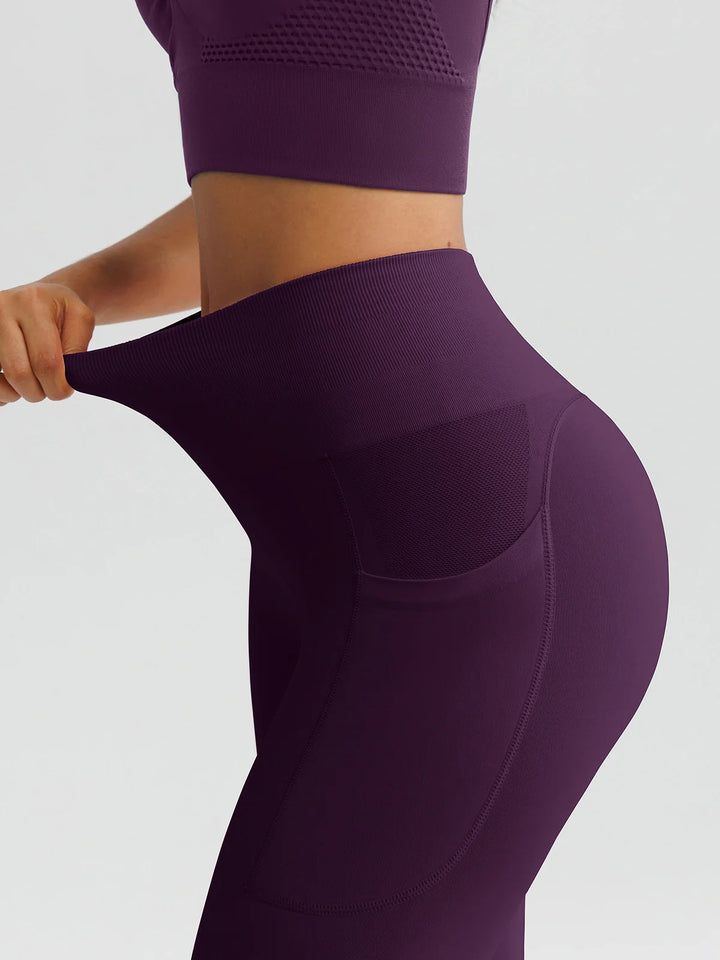 A model wearing a BRXL® B R X L™ Seamless High Waisted Butt-Lifting Leggings with Pockets