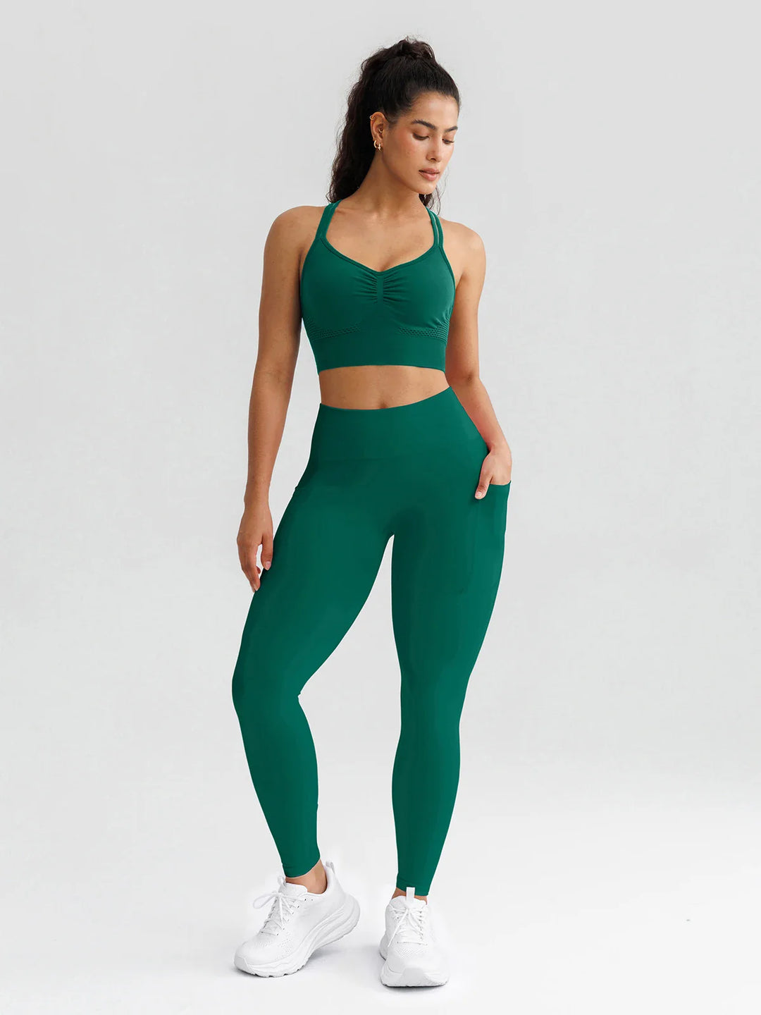 A model wearing a BRXL® B R X L® Seamless High Waisted Butt-Lifting Leggings with Pockets