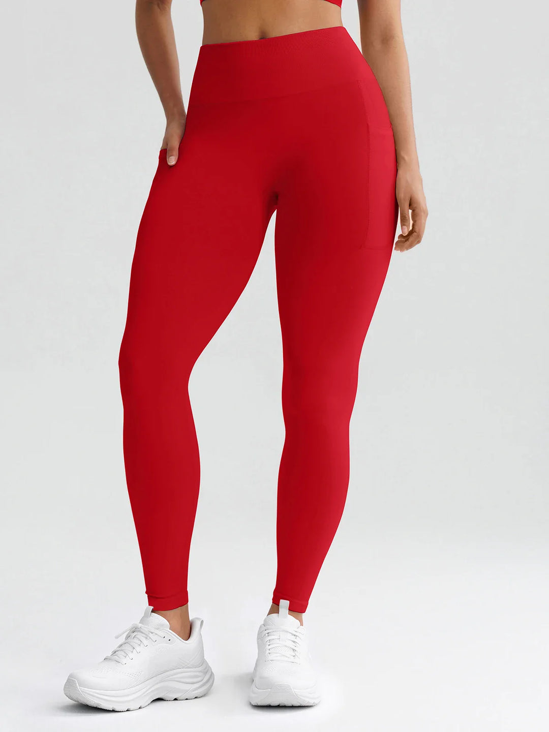 A model wearing a BRXL® B R X L® Seamless High Waisted Butt-Lifting Leggings with Pockets