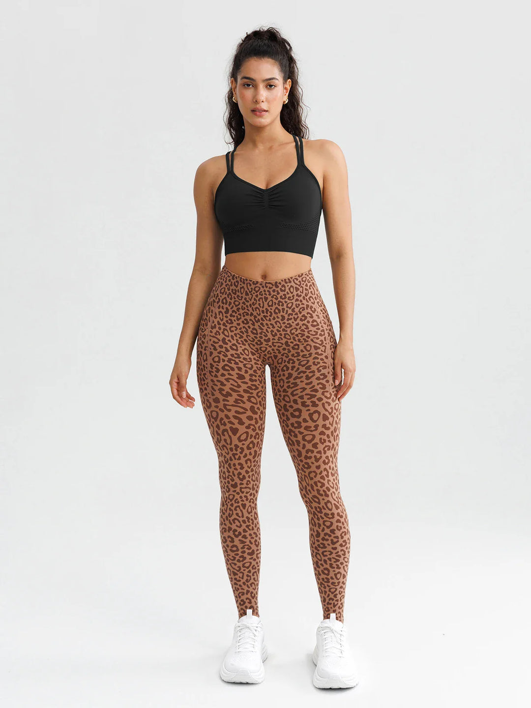 A model wearing a BRXL® B R X L® Seamless High Waisted Butt-Lifting Leggings with Pockets