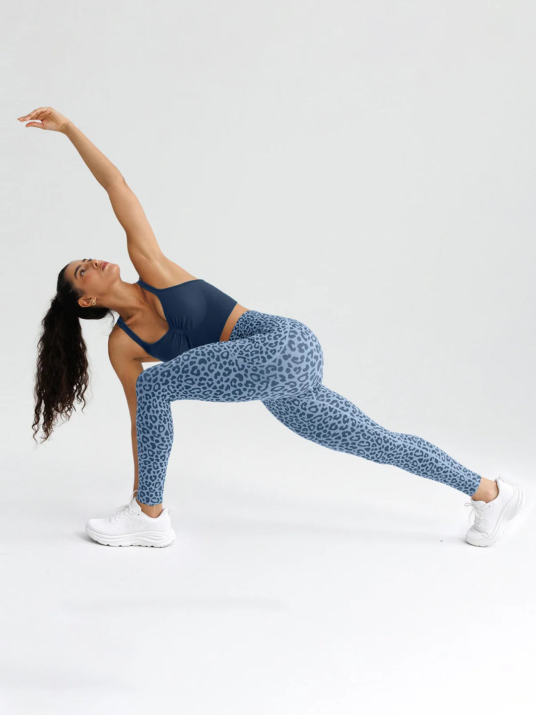 A model wearing a BRXL® B R X L® Seamless High Waisted Butt-Lifting Leggings with Pockets