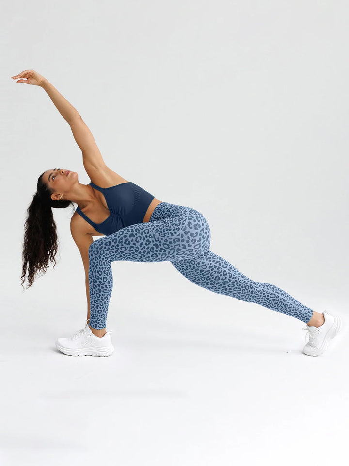 A model wearing a BRXL® B R X L® Seamless High Waisted Butt-Lifting Leggings with Pockets