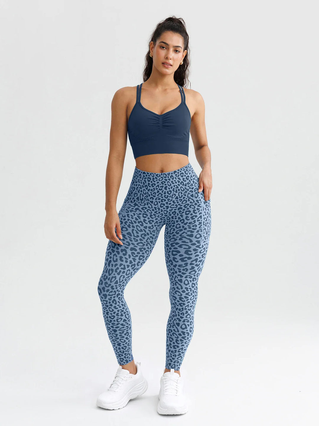 A model wearing a BRXL® B R X L® Seamless High Waisted Butt-Lifting Leggings with Pockets