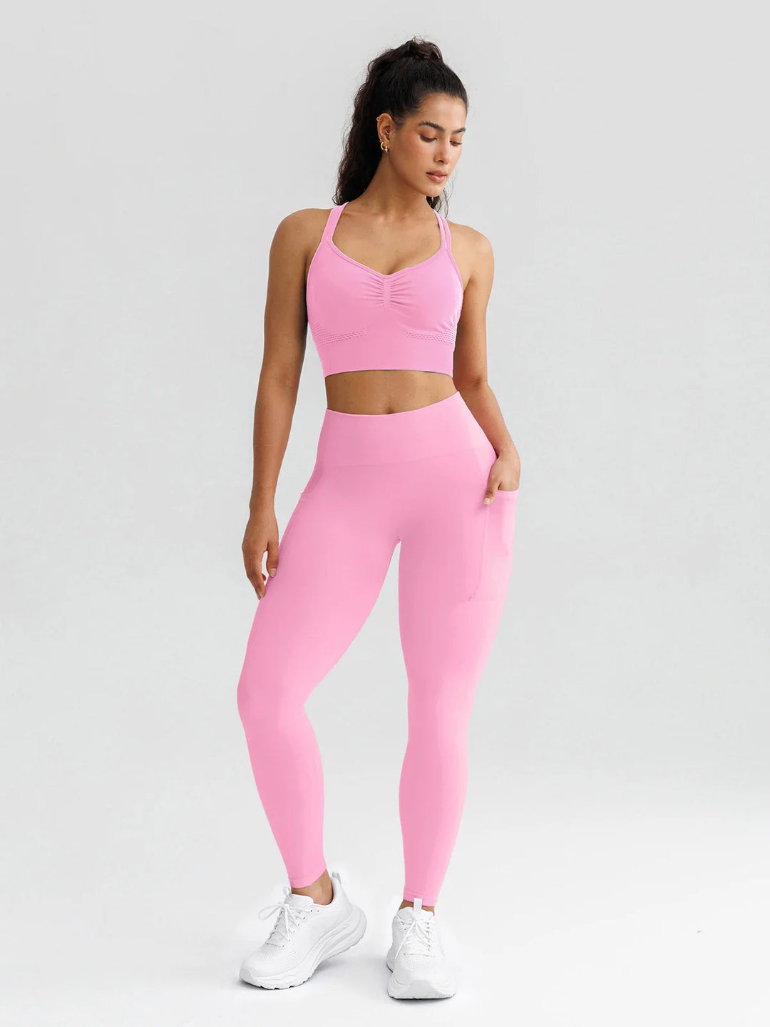 A model wearing a BRXL® B R X L® Seamless High Waisted Butt-Lifting Leggings with Pockets