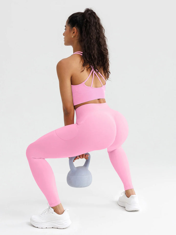 A model wearing a BRXL® B R X L® Seamless High Waisted Butt-Lifting Leggings with Pockets