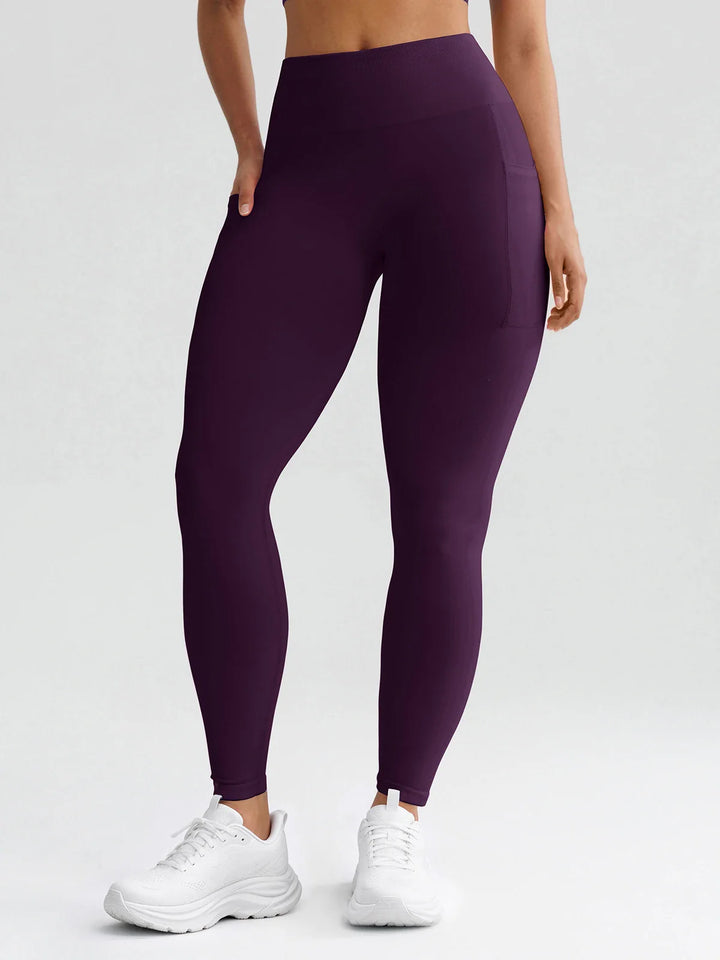 A model wearing a BRXL® B R X L® Seamless High Waisted Butt-Lifting Leggings with Pockets
