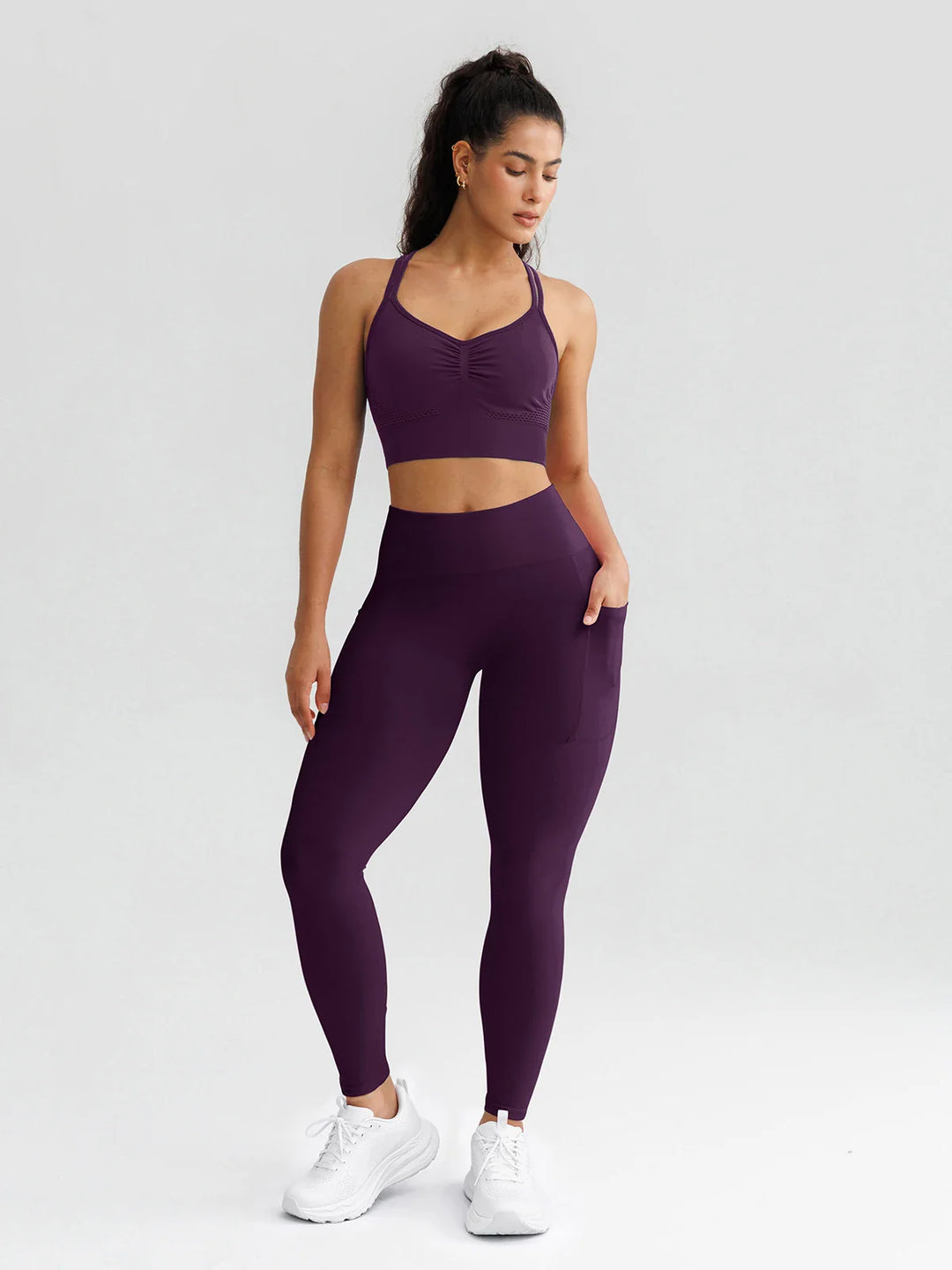 A model wearing a BRXL® B R X L® Seamless High Waisted Butt-Lifting Leggings with Pockets