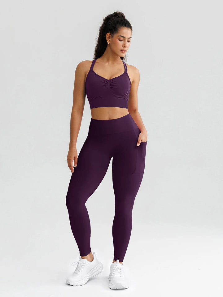 A model wearing a BRXL® B R X L® Seamless High Waisted Butt-Lifting Leggings with Pockets