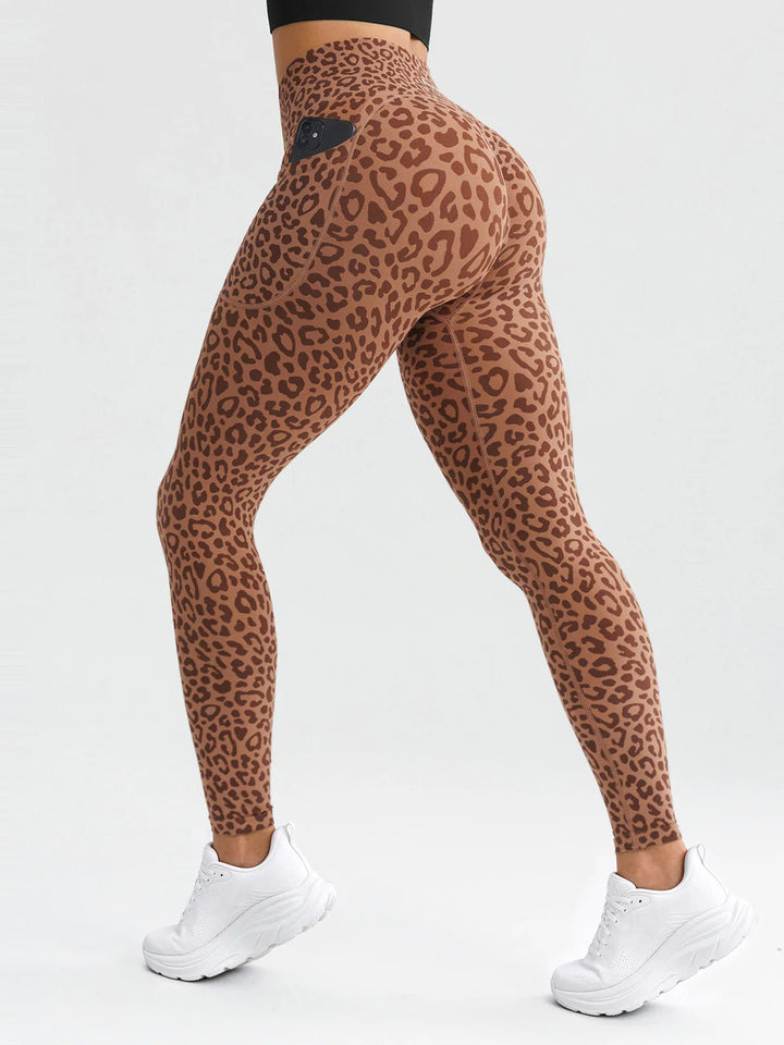 A model wearing a BRXL® B R X L® Seamless High Waisted Butt-Lifting Leggings with Pockets Leopard / S