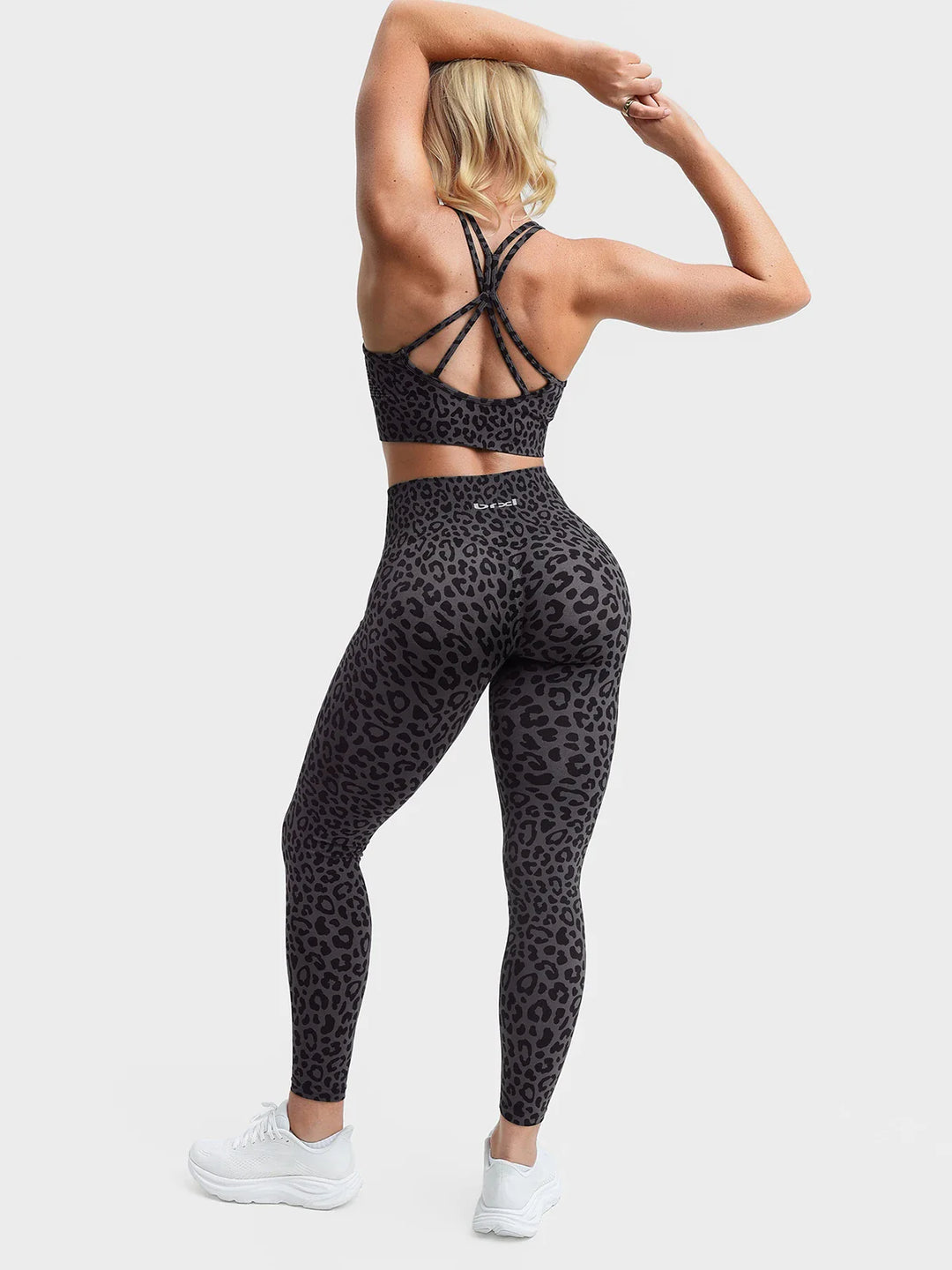 A model wearing a BRXL® B R X L®  Seamless Pro 2.0 High-Stretch LYCRA® High-Rise Sculpt Leggings