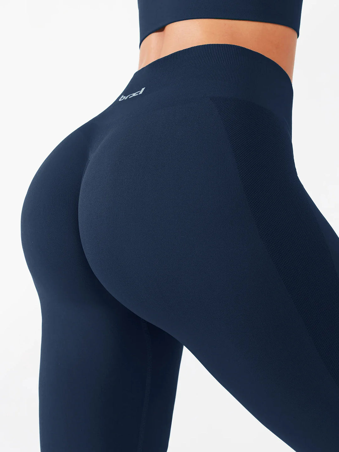 A model wearing a BRXL® B R X L®  Seamless Pro 2.0 High-Stretch LYCRA® High-Rise Sculpt Leggings