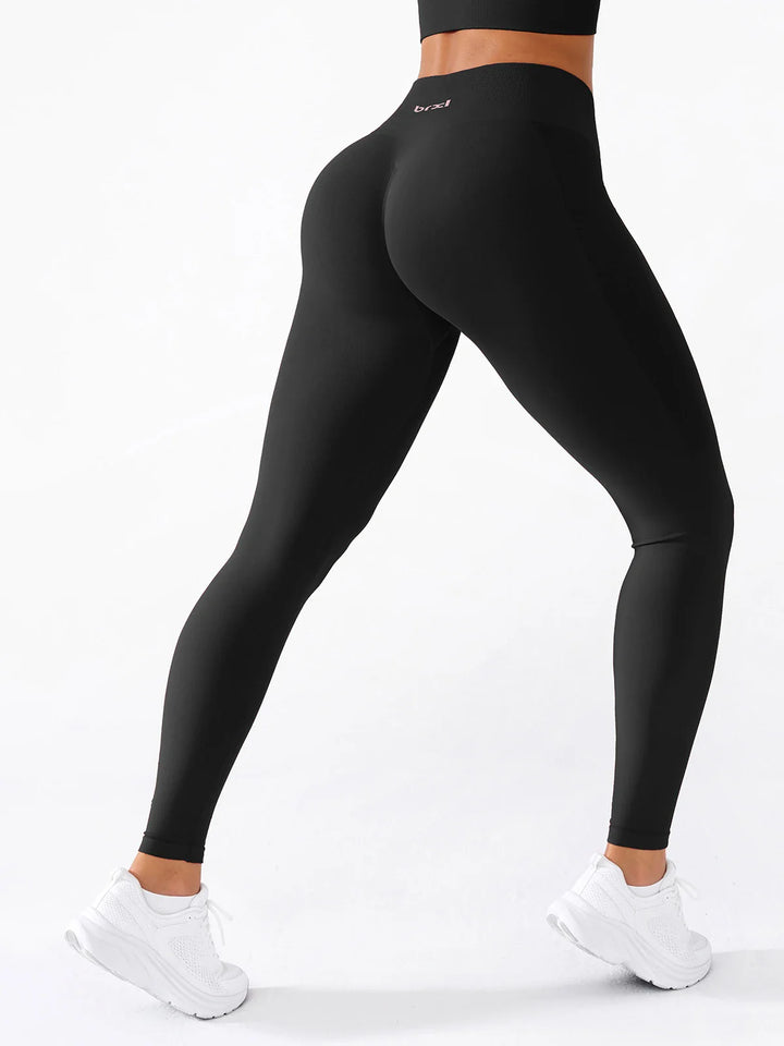 A model wearing a BRXL® B R X L®  Seamless Pro 2.0 High-Stretch LYCRA® High-Rise Sculpt Leggings