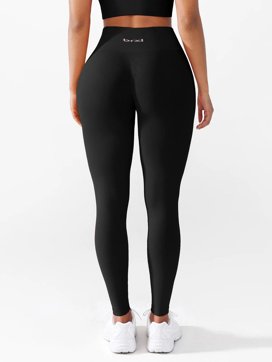 A model wearing a BRXL® B R X L®  Seamless Pro 2.0 High-Stretch LYCRA® High-Rise Sculpt Leggings