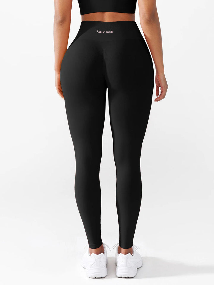 A model wearing a BRXL® B R X L®  Seamless Pro 2.0 High-Stretch LYCRA® High-Rise Sculpt Leggings