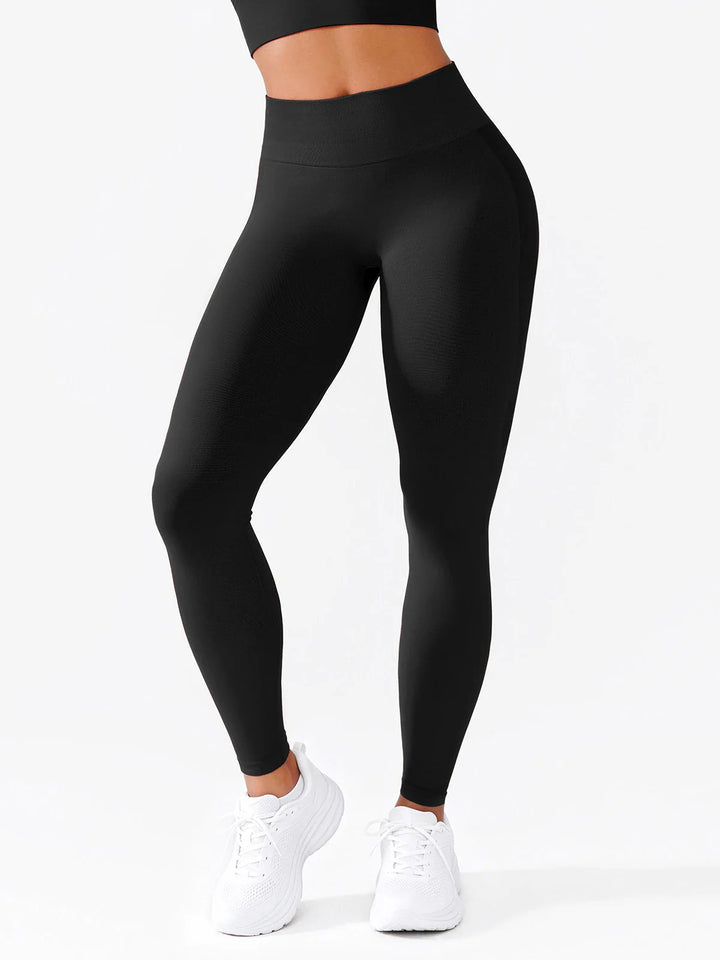 A model wearing a BRXL® B R X L®  Seamless Pro 2.0 High-Stretch LYCRA® High-Rise Sculpt Leggings