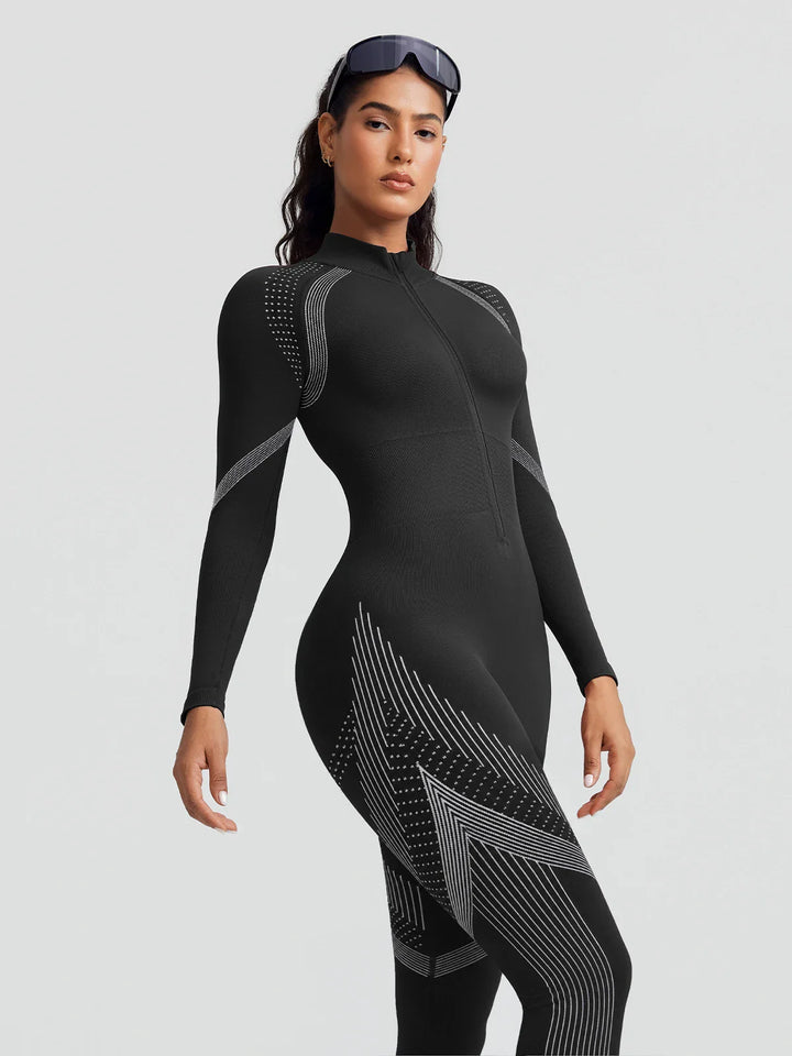 A model wearing a BRXL® BrxlGrit™ Long Sleeve Sculpting Contrast Workout Zip Up Jumpsuit