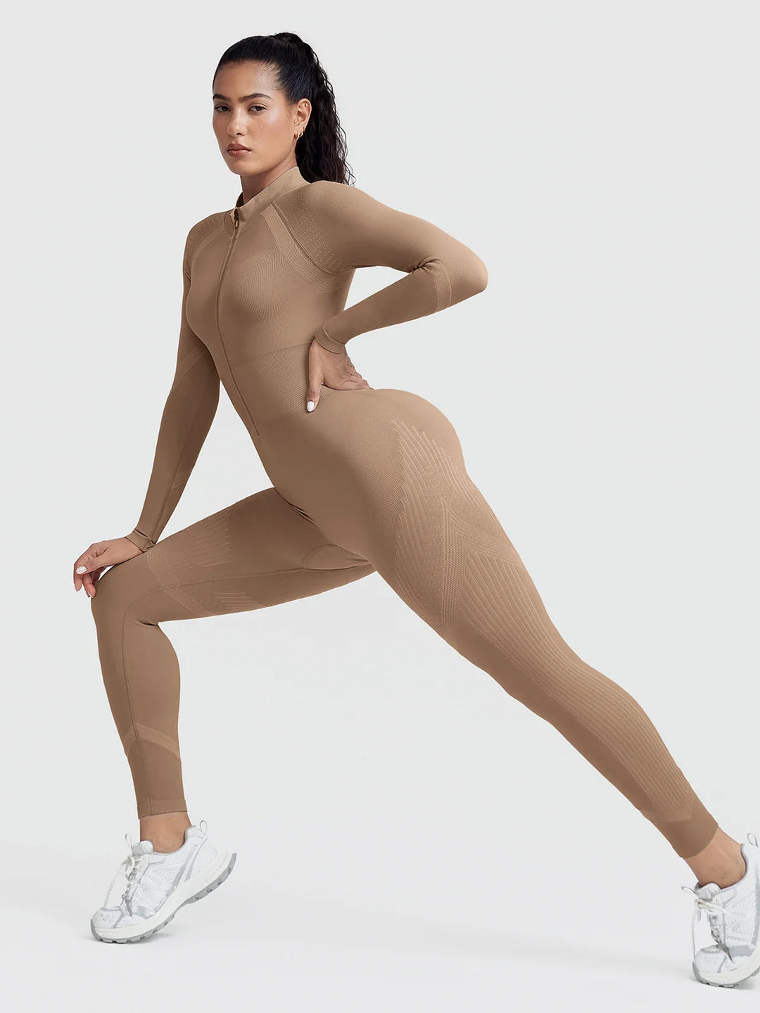 A model wearing a BRXL® BrxlGrit™ Long Sleeve Sculpting Contrast Workout Zip Up Jumpsuit