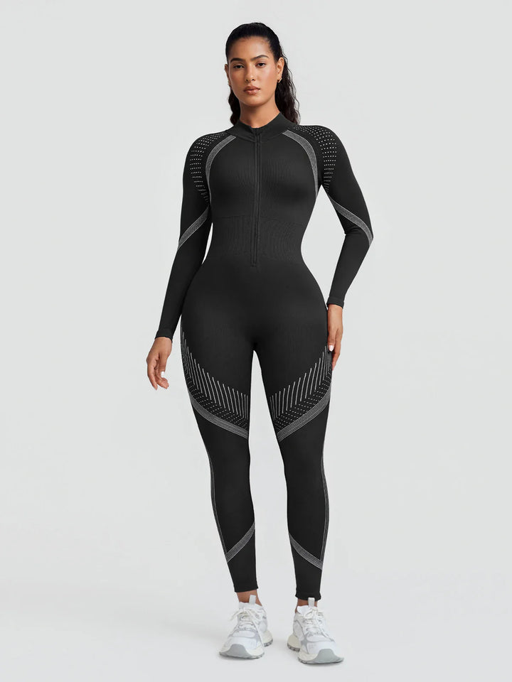 A model wearing a BRXL® BrxlGrit™ Long Sleeve Sculpting Contrast Workout Zip Up Jumpsuit Black / XS