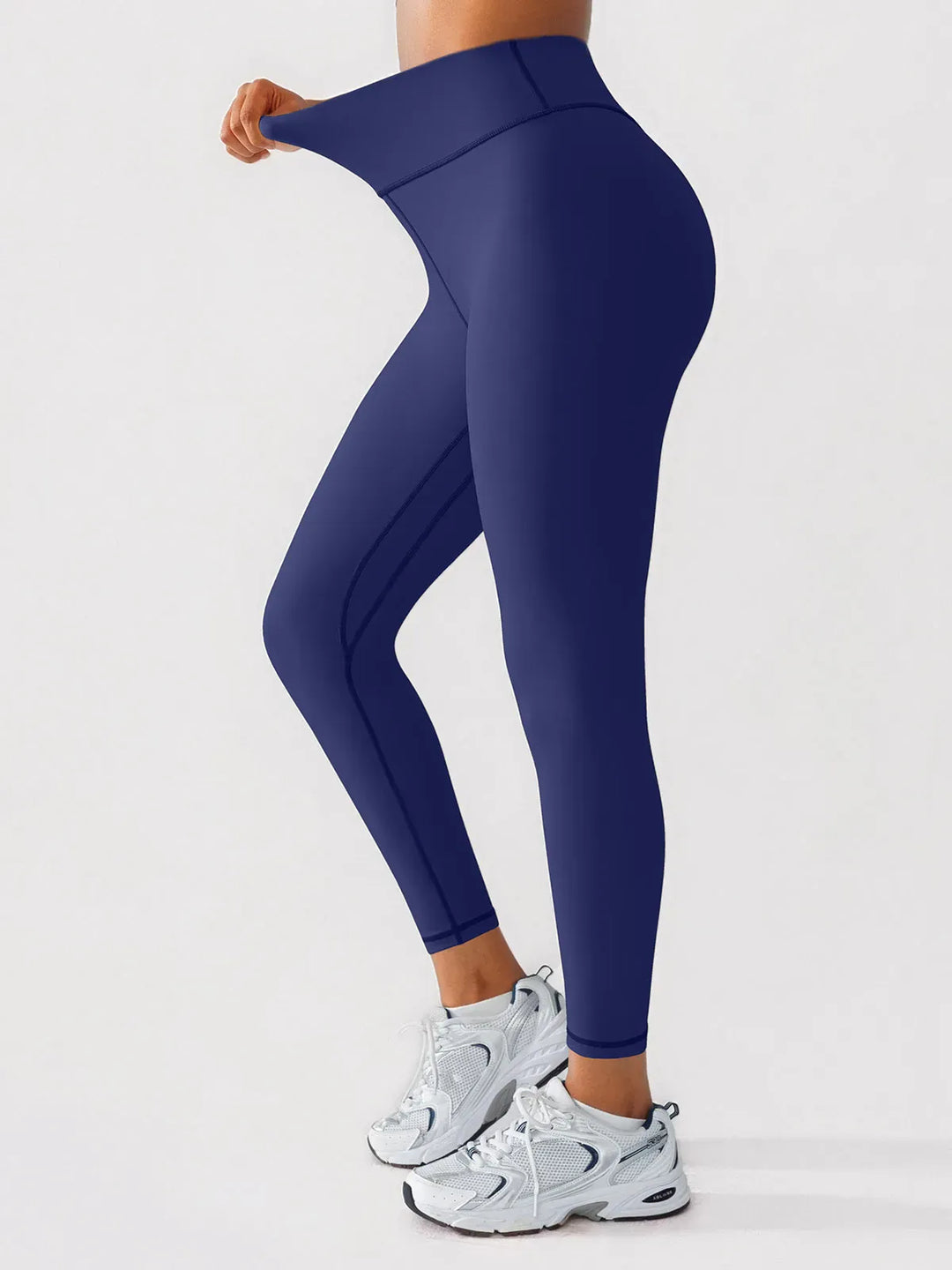 A model wearing a BRXL® BrxlGrit™ Scrunch High Rise Gym Leggings in