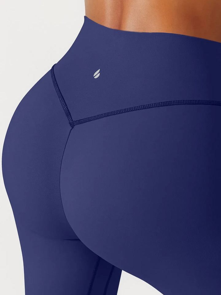 A model wearing a BRXL® BrxlGrit™ Scrunch High Rise Gym Leggings in