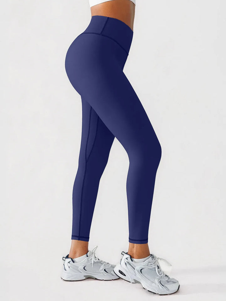 A model wearing a BRXL® BrxlGrit™ Scrunch High Rise Gym Leggings in