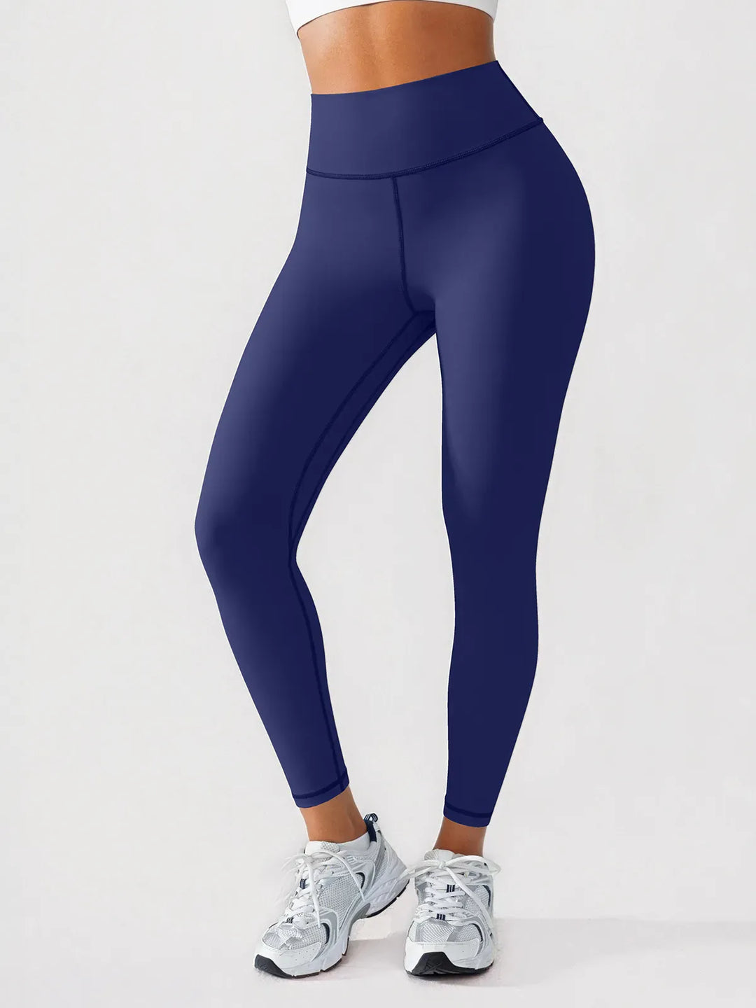 A model wearing a BRXL® BrxlGrit™ Scrunch High Rise Gym Leggings in