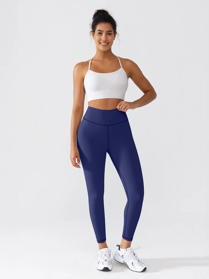 A model wearing a BRXL® BrxlGrit™ Scrunch High Rise Gym Leggings in