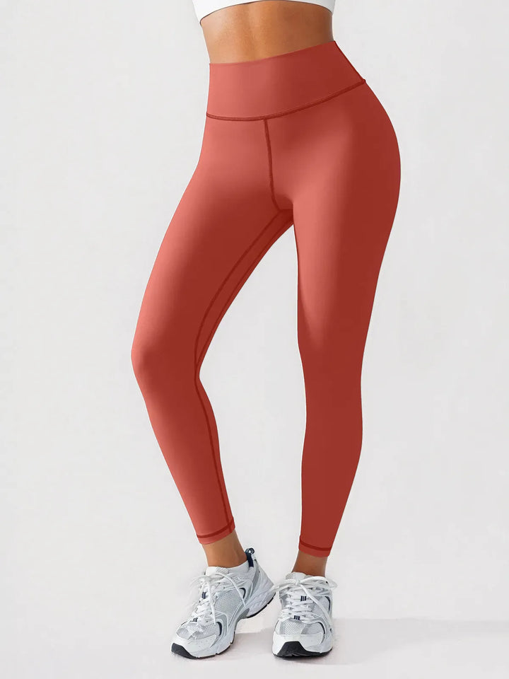 A model wearing a BRXL® BrxlGrit™ Scrunch High Rise Gym Leggings in