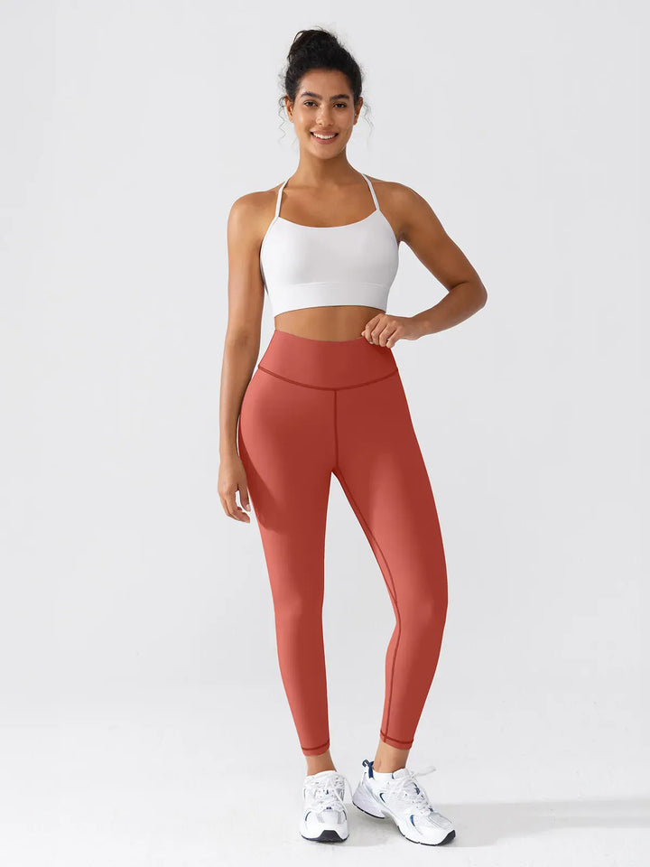A model wearing a BRXL® BrxlGrit™ Scrunch High Rise Gym Leggings in