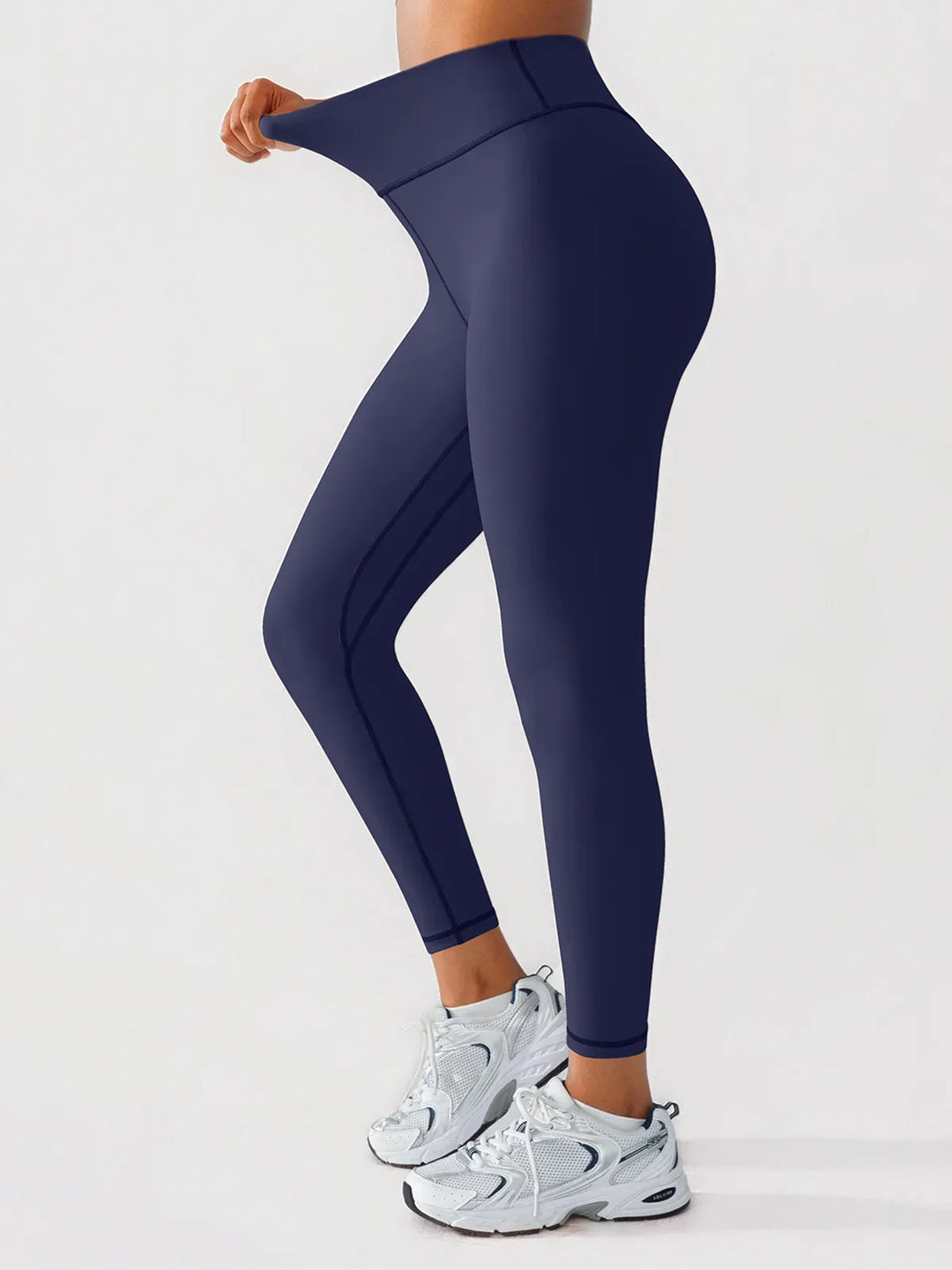 A model wearing a BRXL® BrxlGrit™ Scrunch High Rise Gym Leggings in