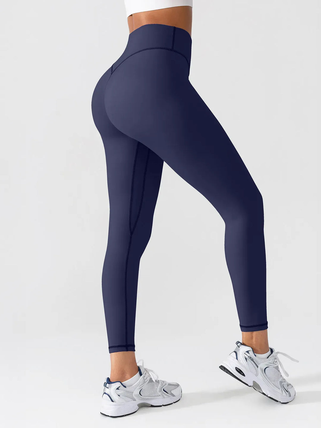 A model wearing a BRXL® BrxlGrit™ Scrunch High Rise Gym Leggings in