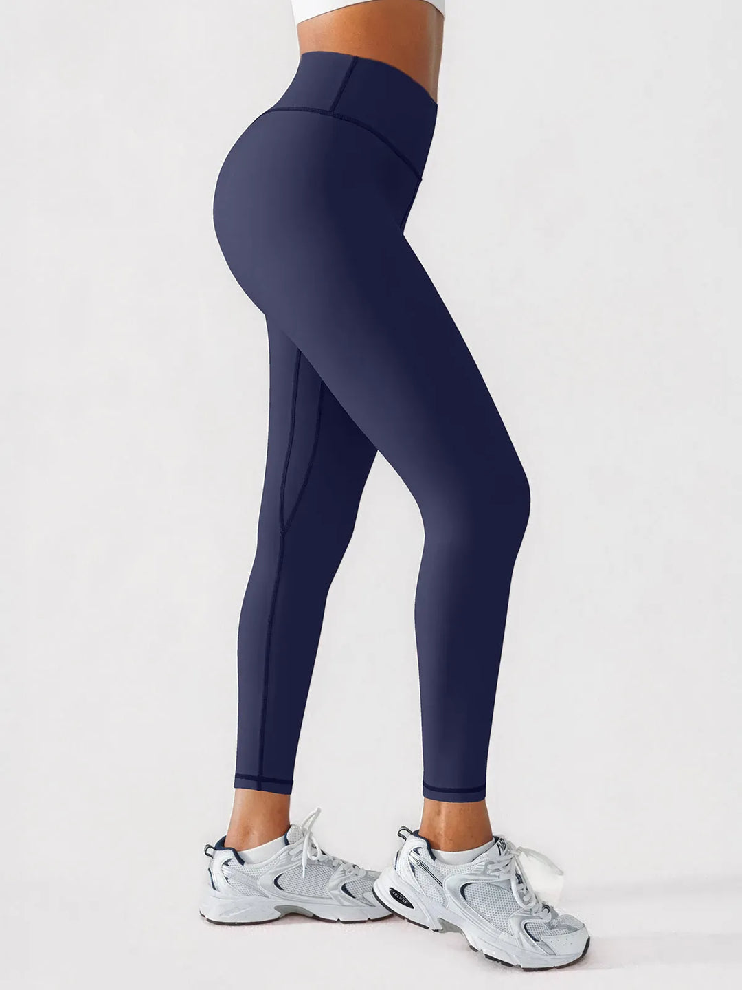 A model wearing a BRXL® BrxlGrit™ Scrunch High Rise Gym Leggings in