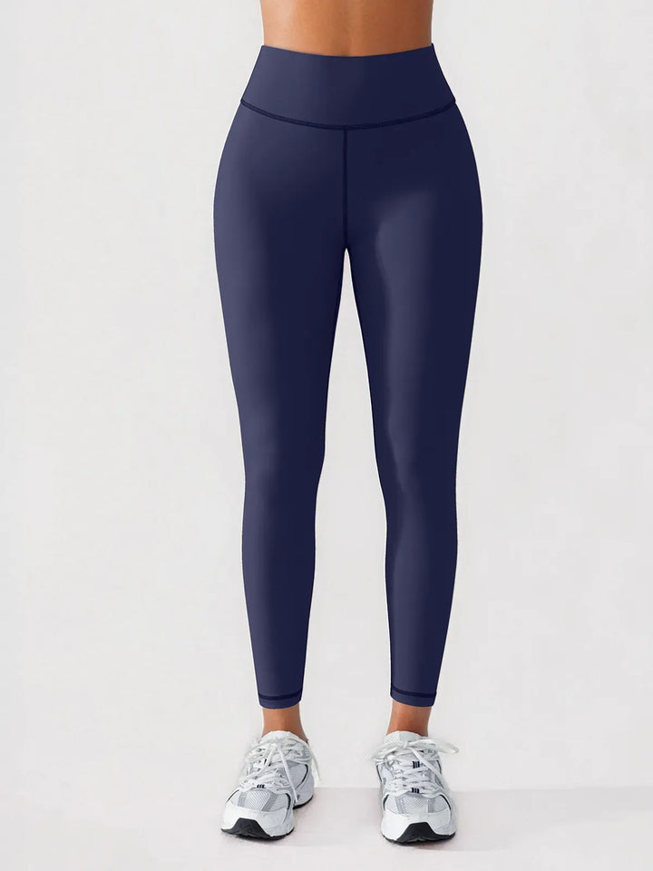 A model wearing a BRXL® BrxlGrit™ Scrunch High Rise Gym Leggings in