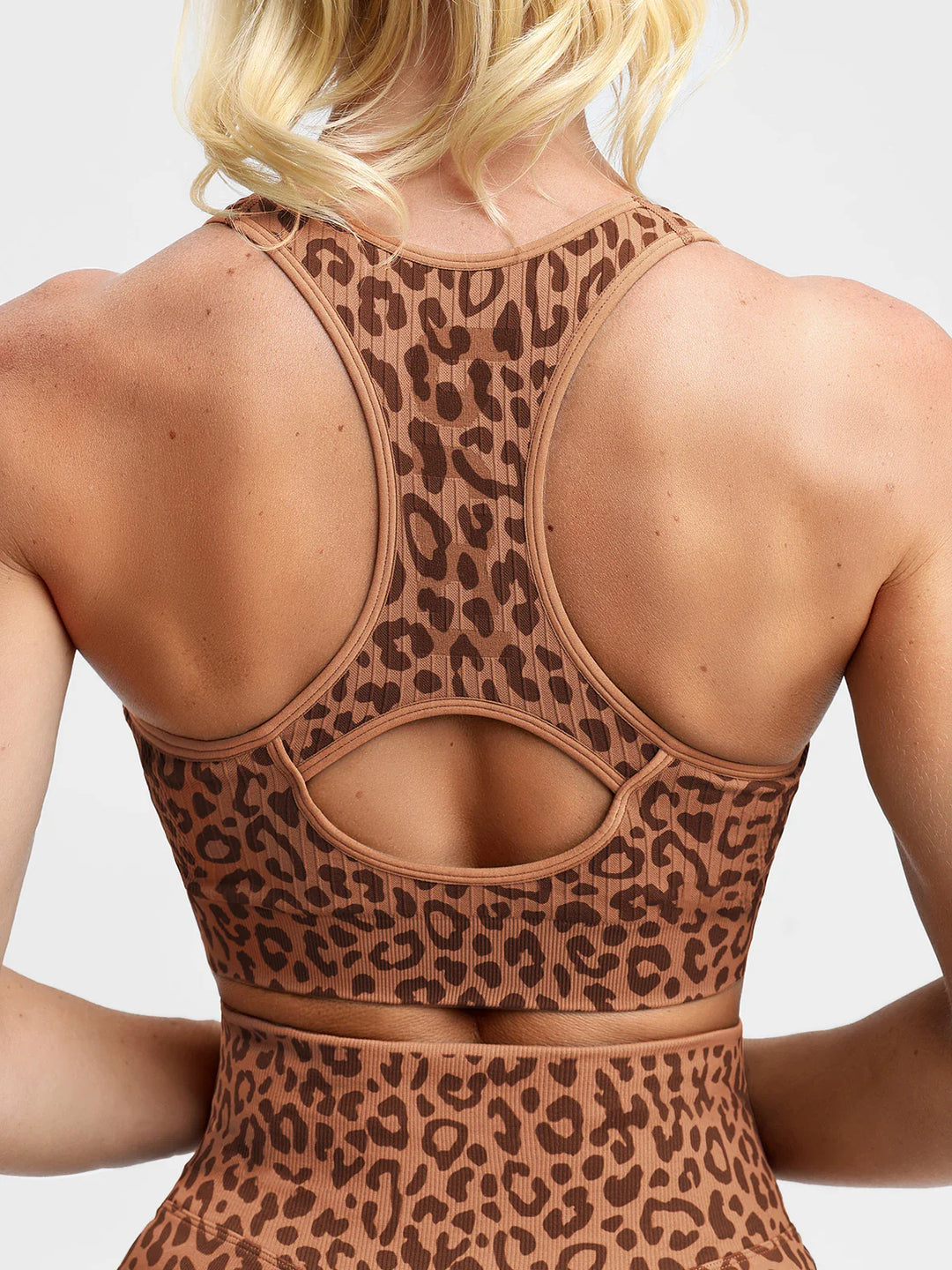 A model wearing a BRXL® BrxlGrit™ Seamless Front Zip Racerback Medium Impact Sports Bra