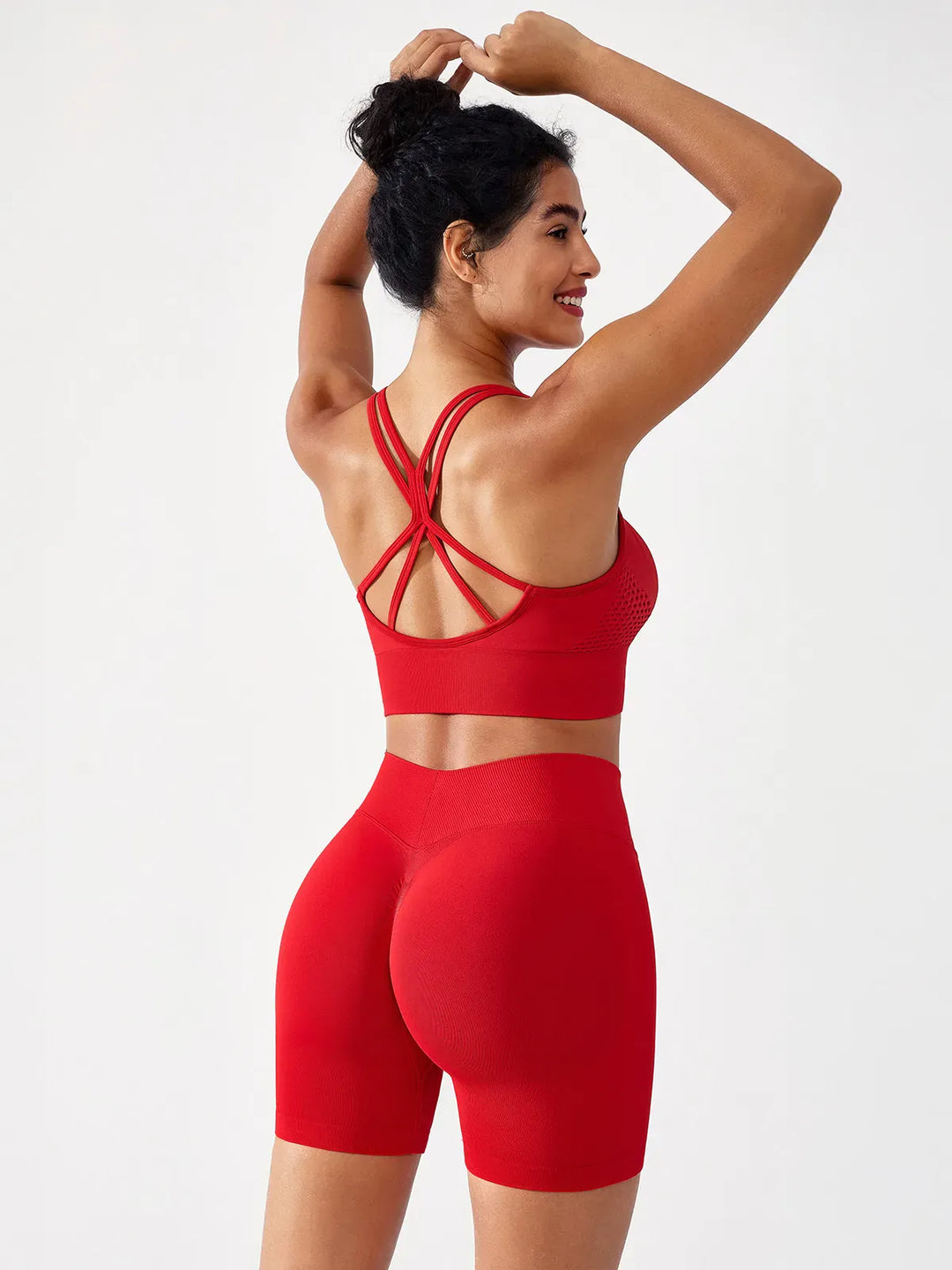 A model wearing a BRXL® BrxlGrit™ Seamless Scrunch Butt Workout Shorts in