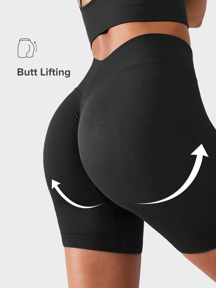 A model wearing a BRXL® BrxlGrit™ Seamless Scrunch Butt Workout Shorts in