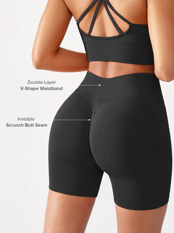 A model wearing a BRXL® BrxlGrit™ Seamless Scrunch Butt Workout Shorts