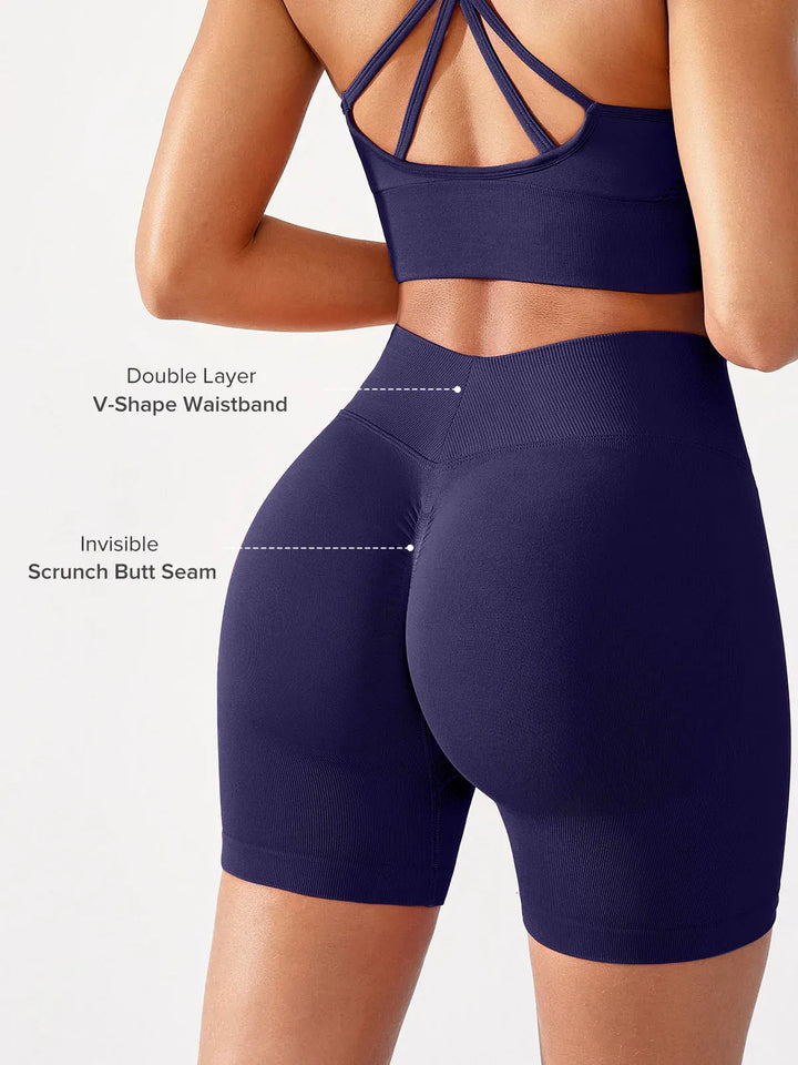 A model wearing a BRXL® BrxlGrit™ Seamless Scrunch Butt Workout Shorts