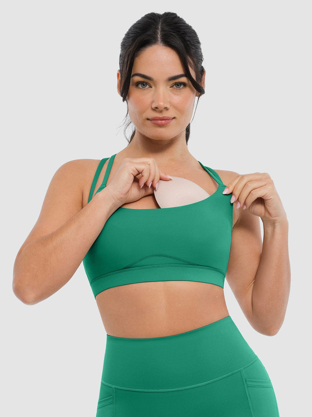 A model wearing a BRXL® BrxlZero™ Cross Back Strappy Sports Bra in