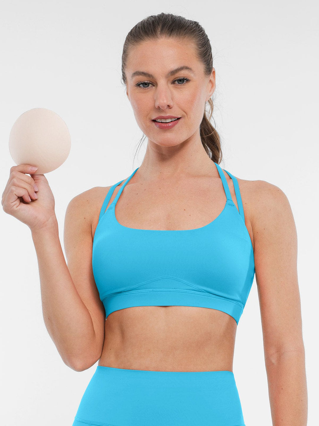 A model wearing a BRXL® BrxlZero™ Cross Back Strappy Sports Bra in