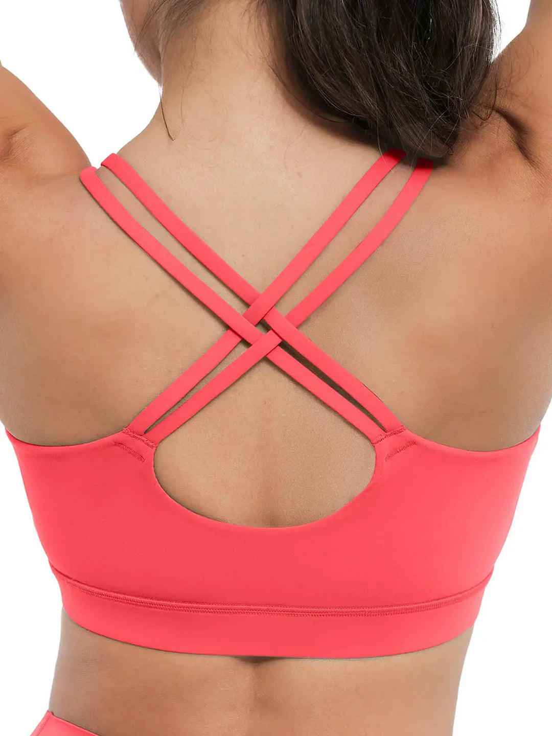 A model wearing a BRXL® BrxlZero™ Cross Back Strappy Sports Bra in