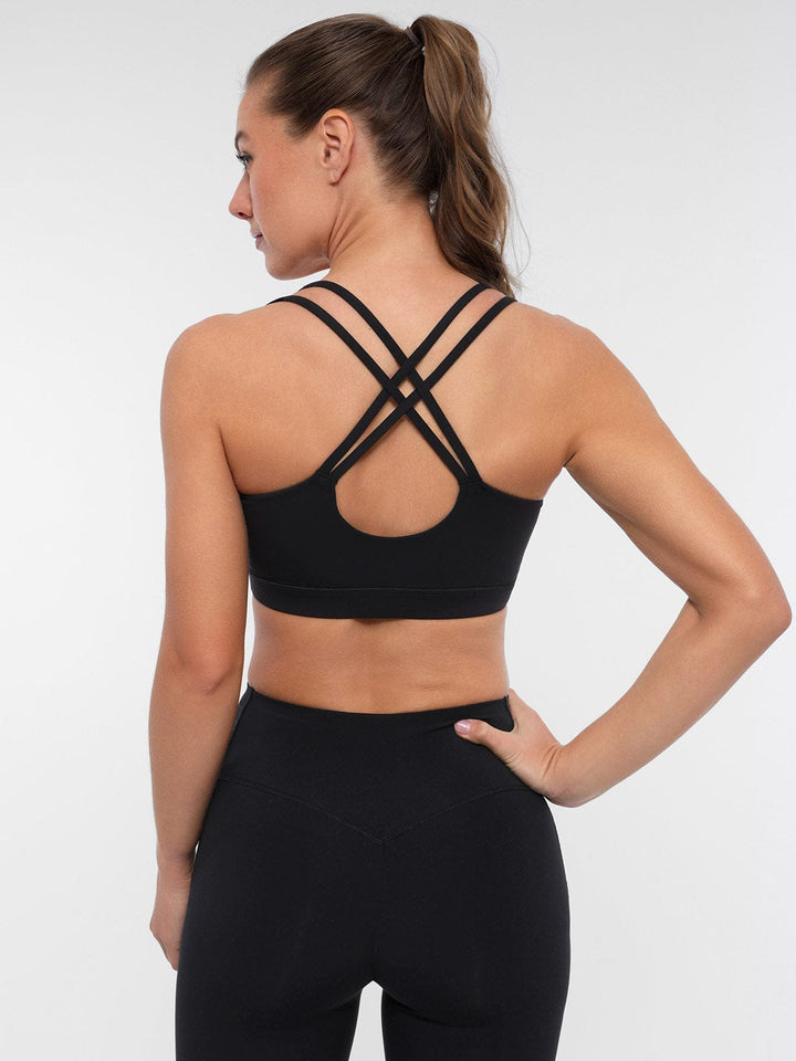 A model wearing a BRXL® BrxlZero™ Cross Back Strappy Sports Bra in